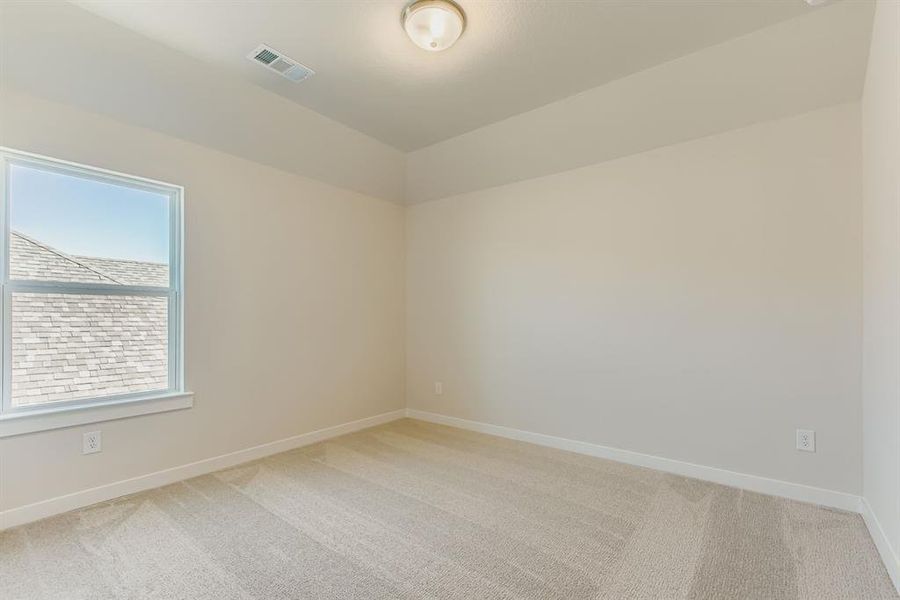 Unfurnished room featuring light colored carpet and baseboards
