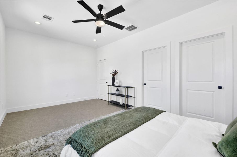 All bedrooms feature ceiling fans and sleek flooring.