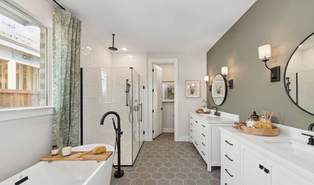 Primary bath with freestanding tub and dual vanities Primary bath with freestanding tub and dual vanities