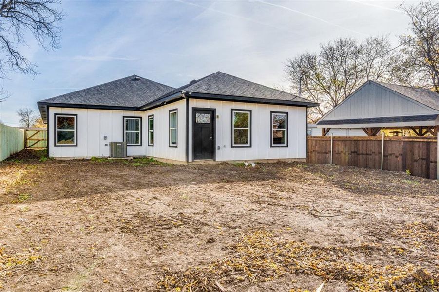 Back of house featuring central AC