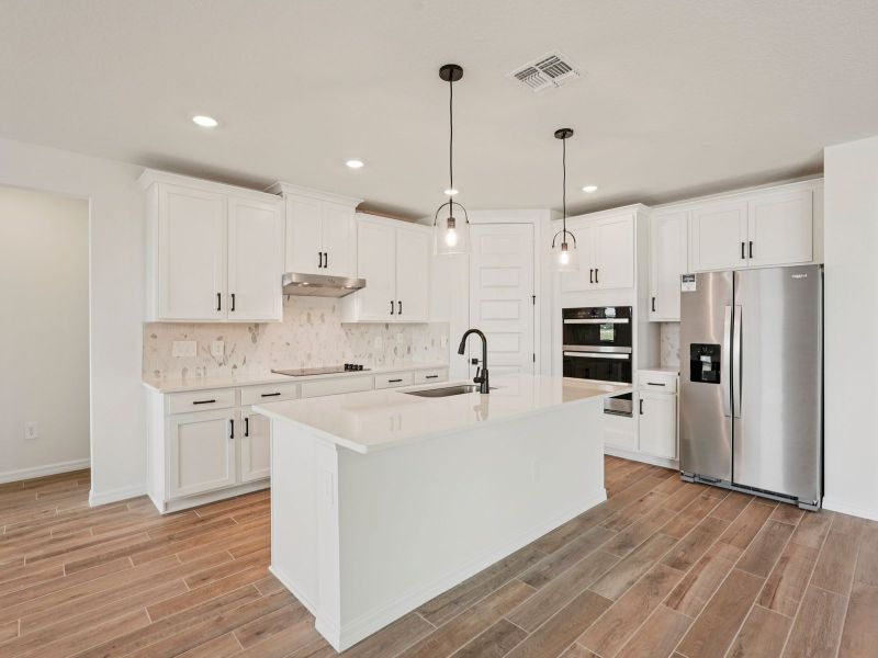 Furnished interior view inside a new home in Oakfield Trails - Signature Series, Parrish (Image 5). Furnished interior view inside a new home in Oakfield Trails - Signature Series, Parrish (Image 5).