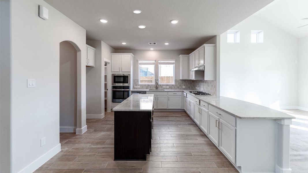 Furnished interior view inside a new home in Sunterra, Katy (Image 3).