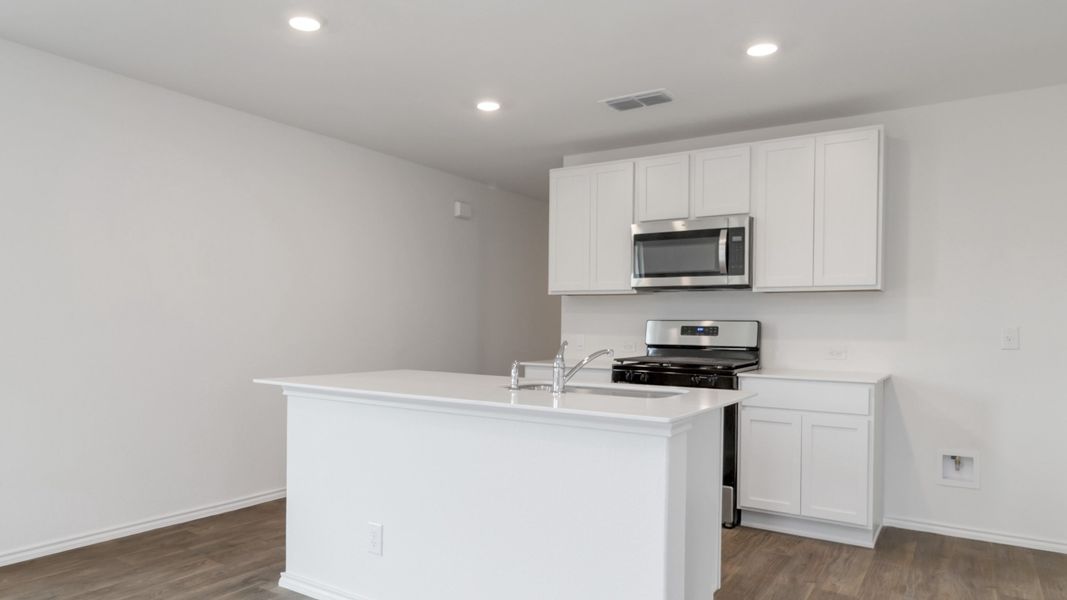 Representative furnished interior of a home built from the T30B Barton by D.R. Horton in Riverfield, Josephine (Image 8).
