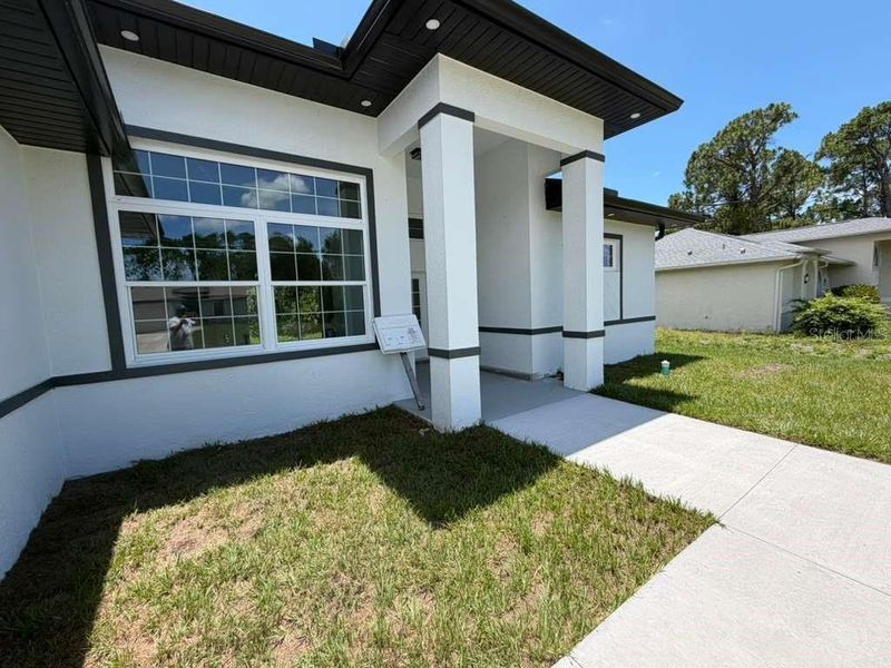 Exterior details and patio area of a home in , North Port (Image 3).