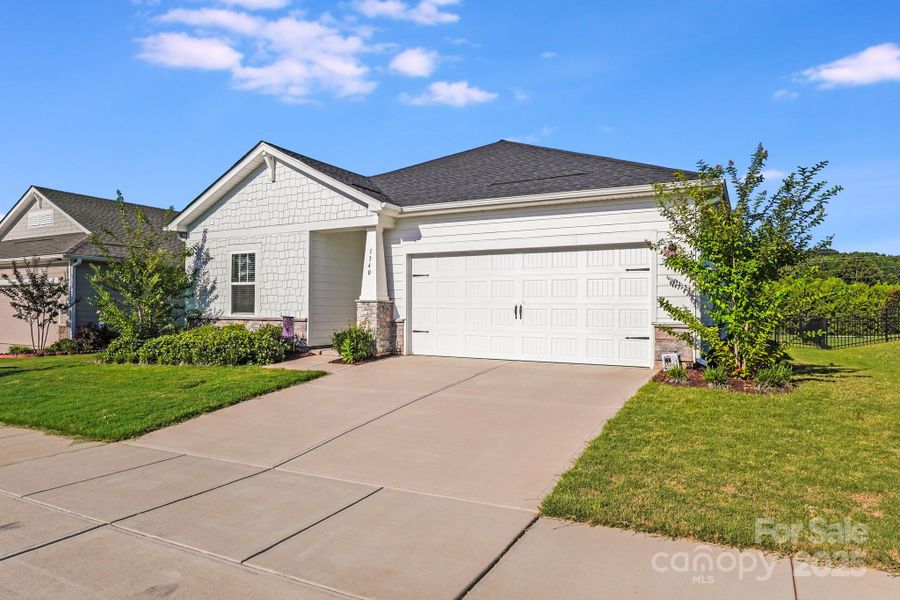 Front exterior of a new home in Simpson Farms, Monroe, NC, highlighting curb appeal (Image 1). Front exterior of a new home in Simpson Farms, Monroe, NC, highlighting curb appeal (Image 1).