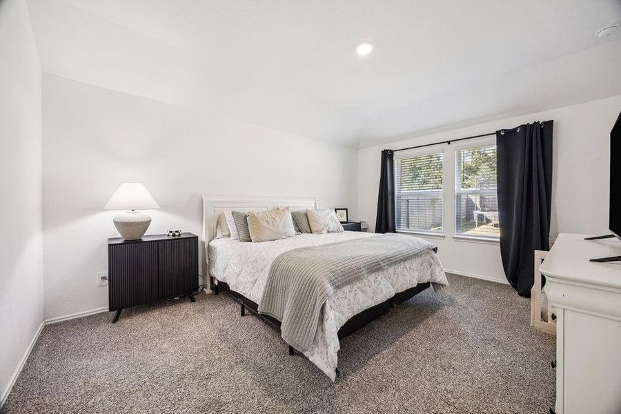 Spacious and inviting primary bedroom featuring abundant natural light and a serene atmosphere, perfect for relaxation. Spacious and inviting primary bedroom featuring abundant natural light and a serene atmosphere, perfect for relaxation.