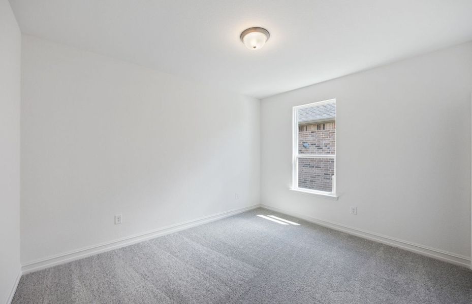 Spacious secondary bedroom with ample closet space