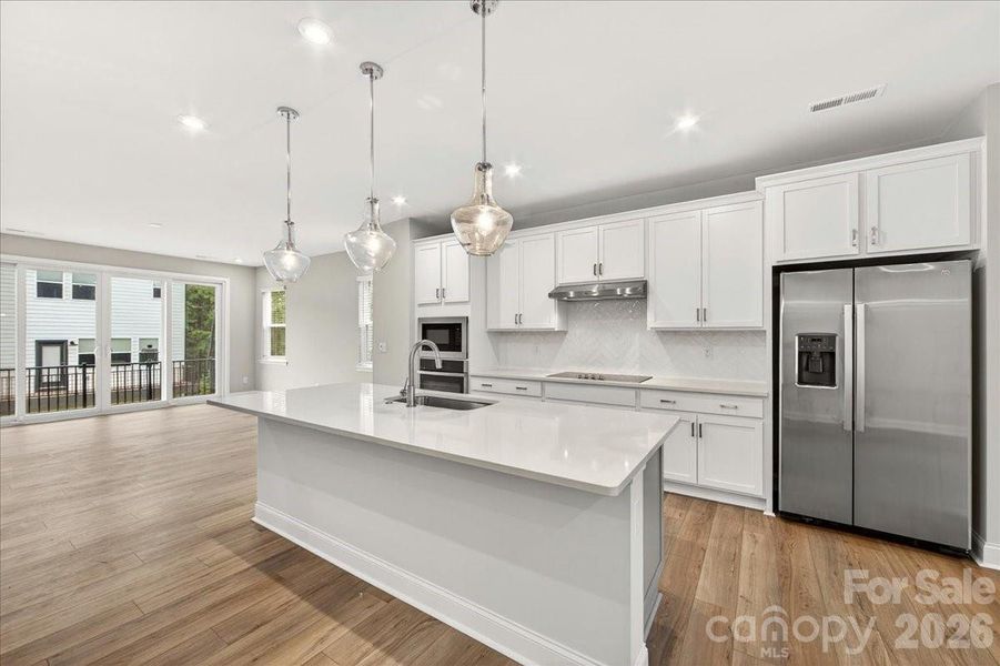 Gourmet kitchen with white cabinets and white quartz countertops Gourmet kitchen with white cabinets and white quartz countertops
