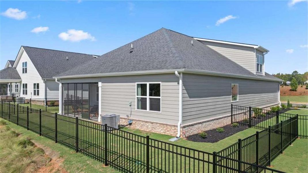 Exterior details and patio area of a home in Oak Ridge Meadows - Active Adult, Locust Grove (Image 24).