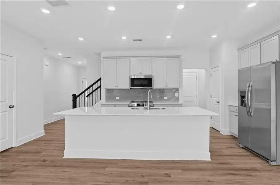 Furnished interior view inside a new home in Towns at Holly Springs, Holly Springs (Image 6). Furnished interior view inside a new home in Towns at Holly Springs, Holly Springs (Image 6).