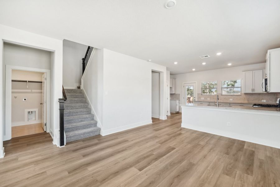 Dining room and kitchen in the Medina floorplan at a Meritage Homes community.