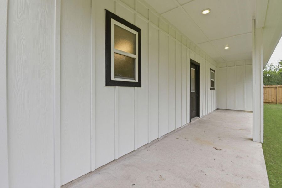 Large backyard fully fenced with covered patio and double gate