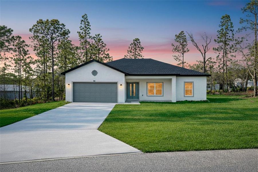 Front exterior of a new home in , Citrus Springs, FL, highlighting curb appeal (Image 1). Front exterior of a new home in , Citrus Springs, FL, highlighting curb appeal (Image 1).