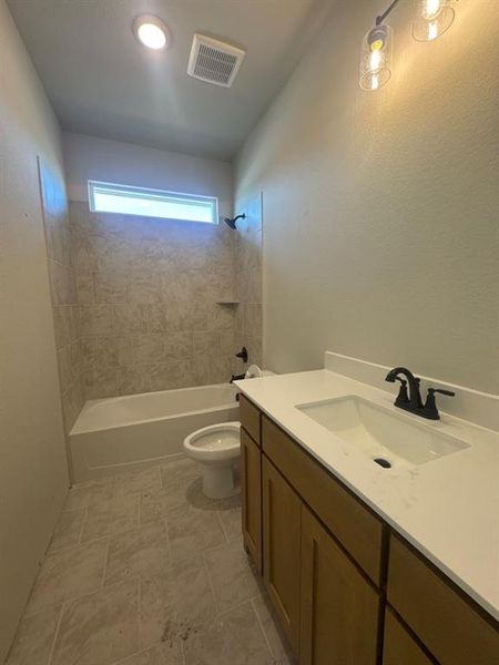 Bathroom with vanity and bathing tub / shower combination