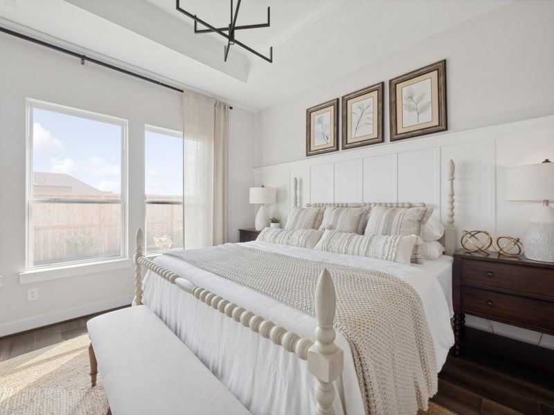 Primary suite with decorative feature wall Primary suite with decorative feature wall