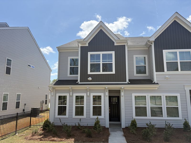 Front exterior of a new home in Sloan Station, Charlotte, NC, highlighting curb appeal (Image 1). Front exterior of a new home in Sloan Station, Charlotte, NC, highlighting curb appeal (Image 1).