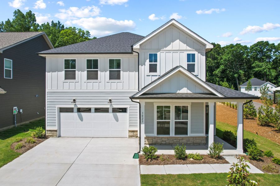 Front exterior of a new home in Elmbrook, Indian Trail, NC, highlighting curb appeal (Image 27). Front exterior of a new home in Elmbrook, Indian Trail, NC, highlighting curb appeal (Image 27).