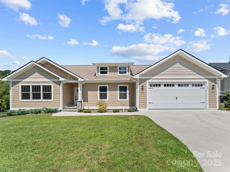 Front exterior of a new home in , Hendersonville, NC, highlighting curb appeal (Image 18). Front exterior of a new home in , Hendersonville, NC, highlighting curb appeal (Image 18).