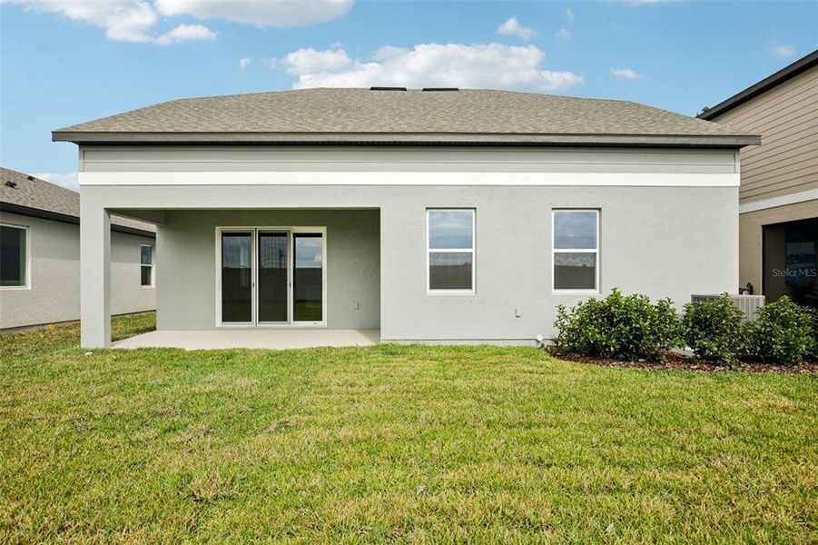 Exterior details and patio area of a home in Oakfield Trails, Parrish (Image 3).