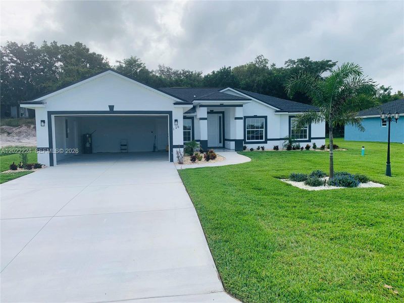 Front exterior of a new home in , Lake Placid, FL, highlighting curb appeal (Image 16).