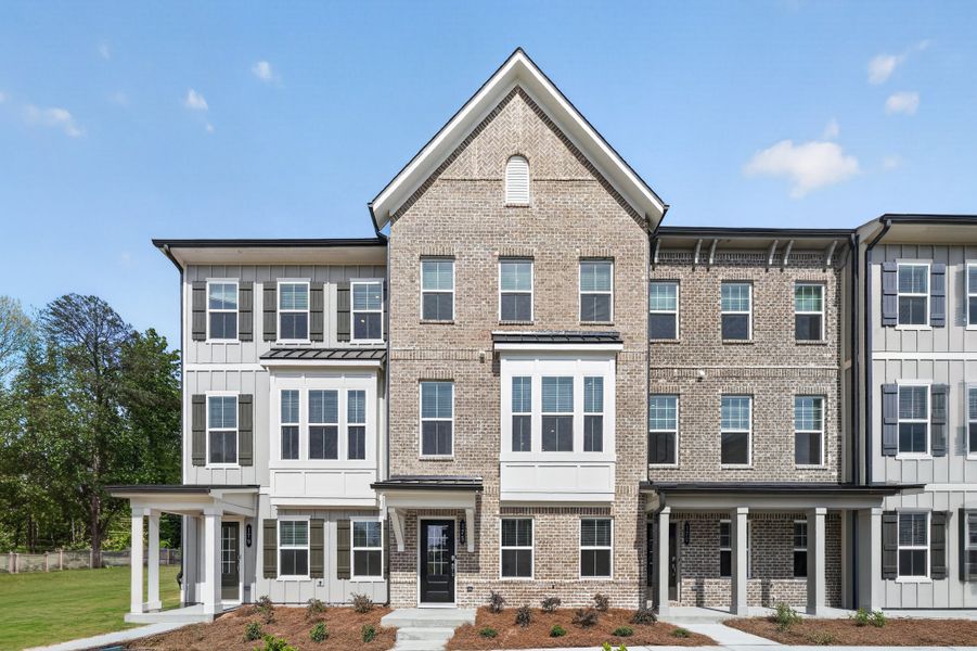 Front exterior of a new home in Forrest Crossing, Woodstock, GA, highlighting curb appeal (Image 1). Front exterior of a new home in Forrest Crossing, Woodstock, GA, highlighting curb appeal (Image 1).