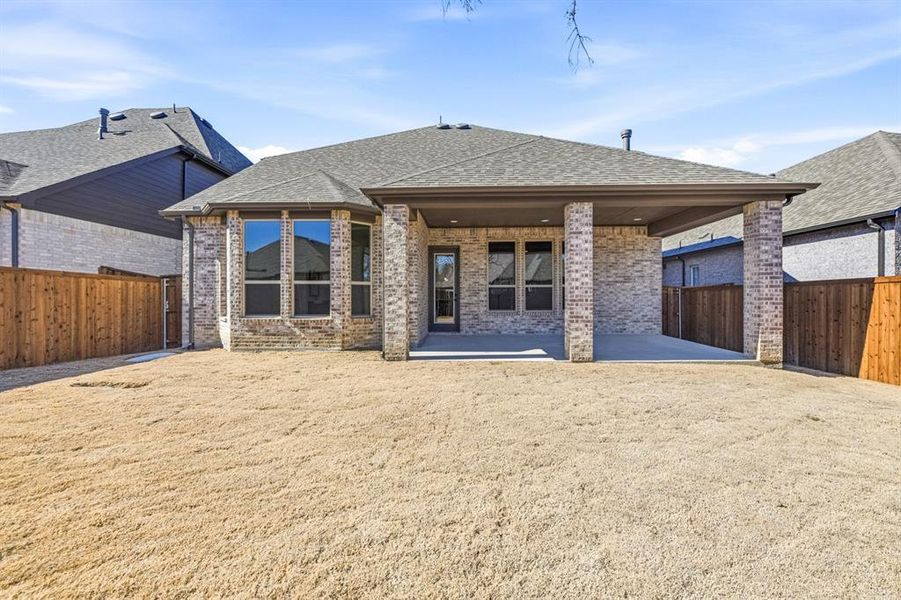 Exterior details and patio area of a home in Wildridge, Oak Point (Image 3).