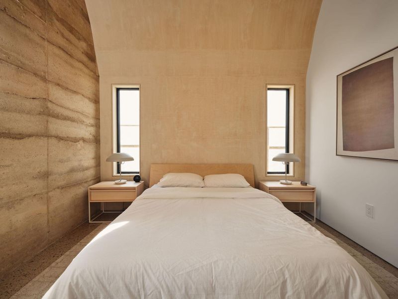 Bedroom with multiple windows