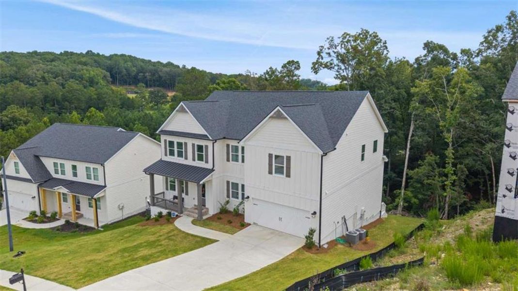 Front exterior of a new home in Silvercrest Lakes, Acworth, GA, highlighting curb appeal (Image 27).