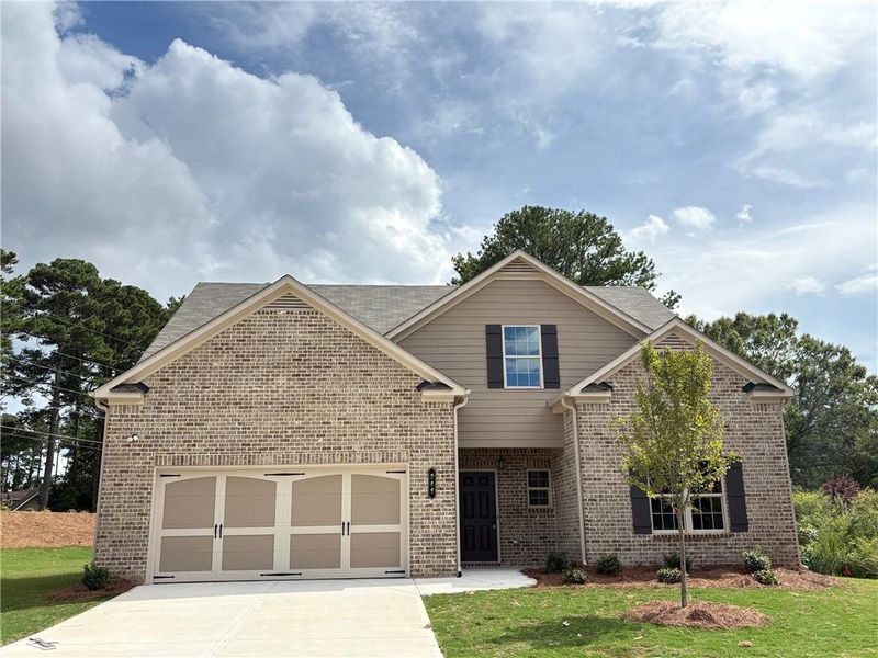 Front exterior of a new home in , Grayson, GA, highlighting curb appeal (Image 2).