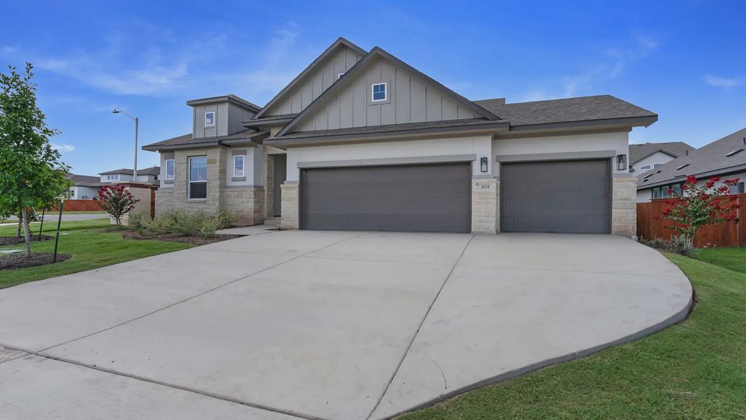 Front exterior of a new home in Santa Rita Ranch, Liberty Hill, TX, highlighting curb appeal (Image 22).