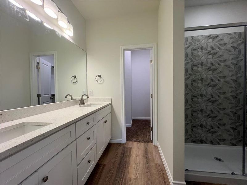 Ensuite bathroom with double vanity, a Full shower with Glass Enclosure & Closet