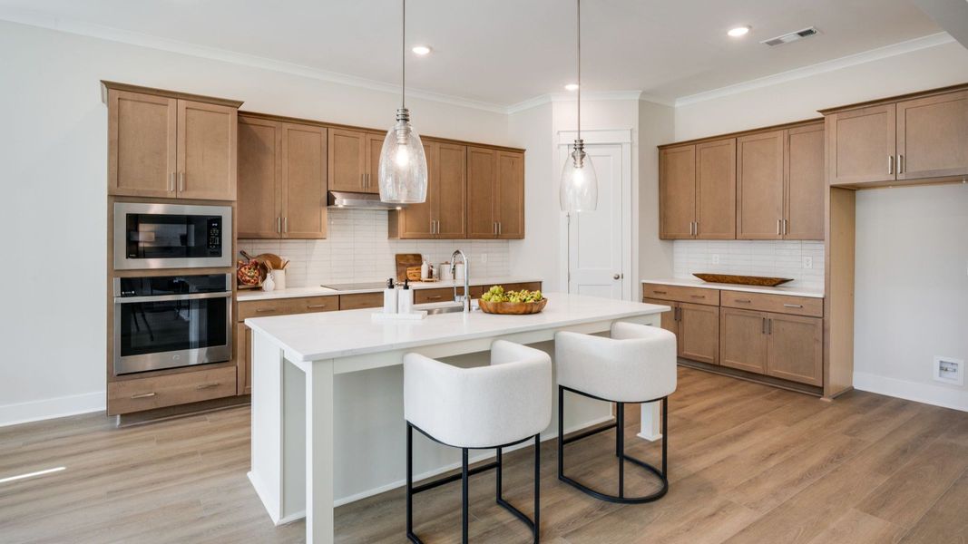 Kitchen with island and various cabinets and countertop spacing