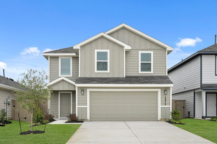 Front exterior of a new home in The Canopies, Splendora, TX, highlighting curb appeal (Image 17).