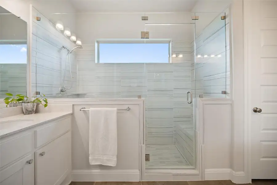 Bathroom with vanity and a stall shower