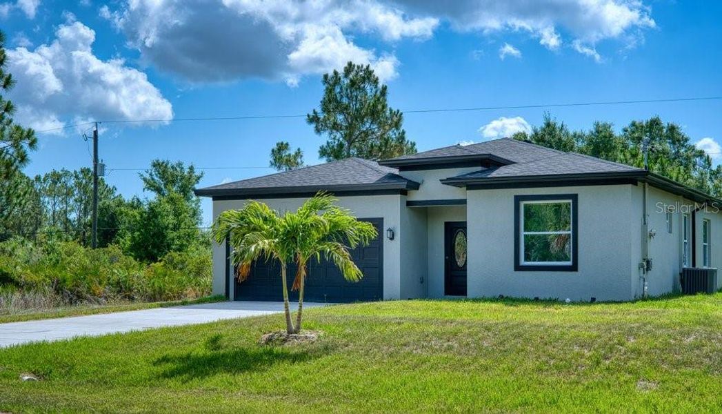 Front exterior of a new home in , Port Charlotte, FL, highlighting curb appeal (Image 2). Front exterior of a new home in , Port Charlotte, FL, highlighting curb appeal (Image 2).