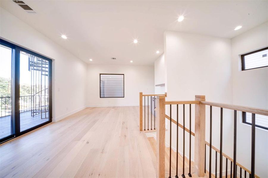 Hallway with light wood-type flooring