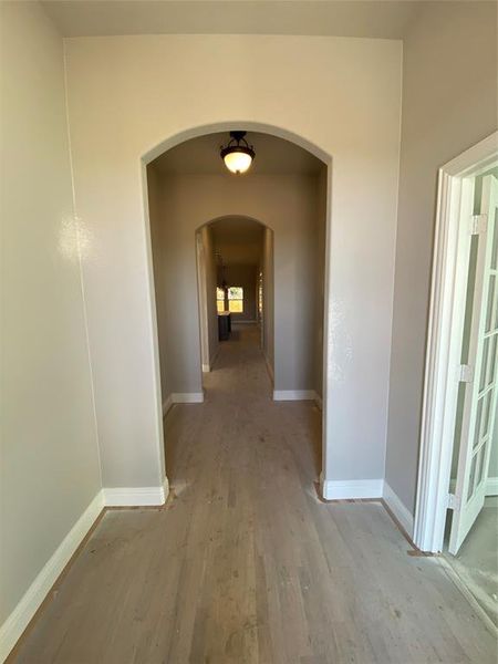 Entrance with elegant arches & 8ft Mission-style mahogany & rain glass front door (hardwoods not stained Aged Barrel Grey w/Black tint yet) Entrance with elegant arches & 8ft Mission-style mahogany & rain glass front door (hardwoods not stained Aged Barrel Grey w/Black tint yet)