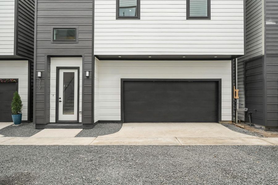 With modern finishes and fixtures inside and out, the front porch offers a welcoming entrance with an 8-foot glass panel door with internal blinds and two coach lights. The smart garage has a Q app and a separate storage room.