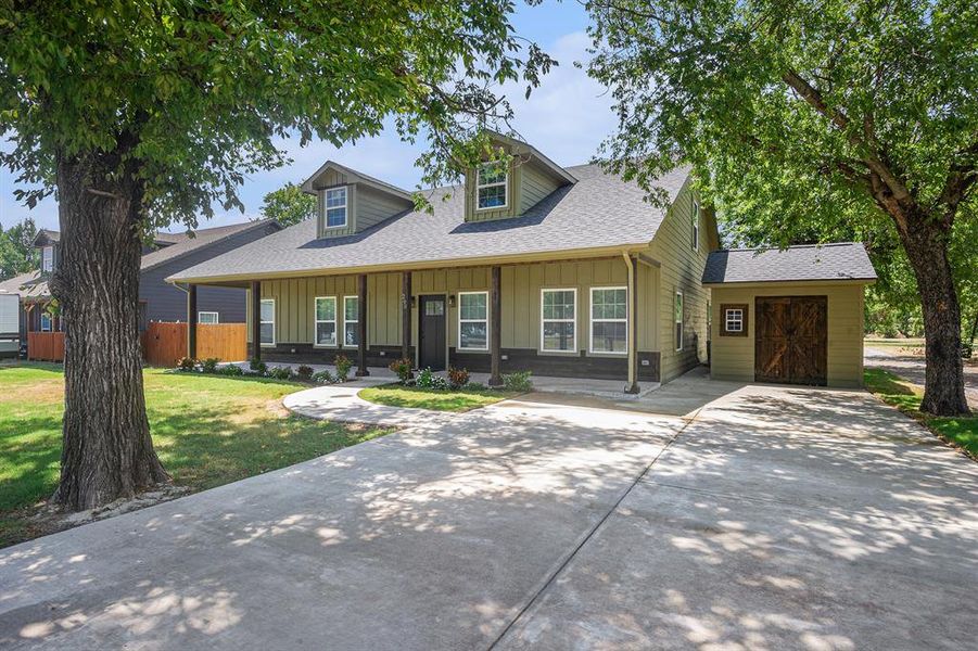 Front exterior of a new home in , Rhome, TX, highlighting curb appeal (Image 15).