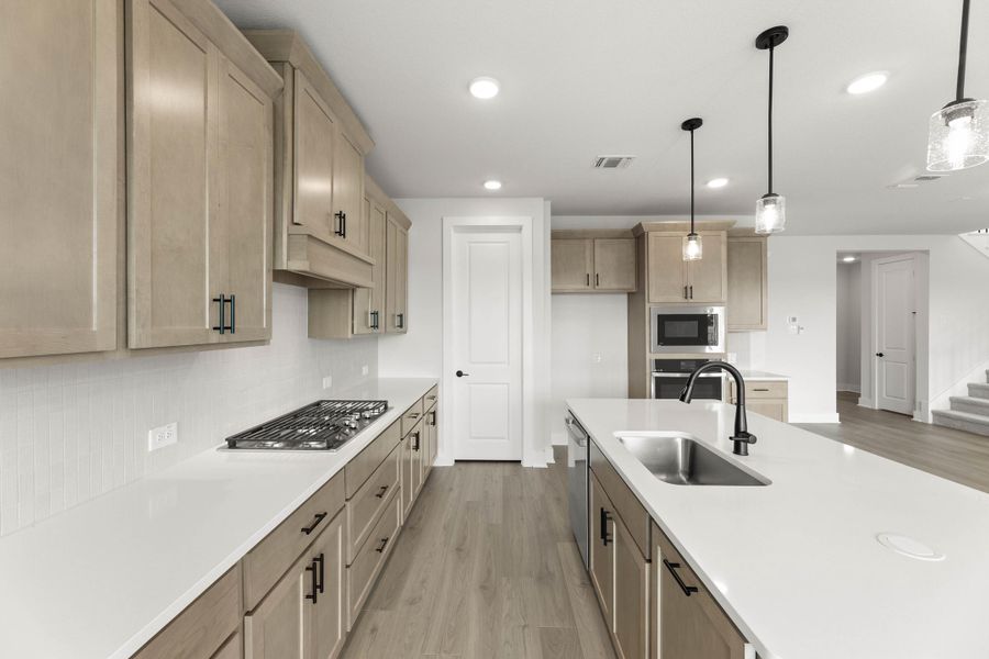 Representative furnished interior of a home built from the Magnolia by Tri Pointe Homes in Treeline, Justin (Image 10).