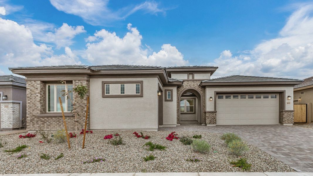 Front exterior of a new home in Windrose, Waddell, AZ, highlighting curb appeal (Image 1). Front exterior of a new home in Windrose, Waddell, AZ, highlighting curb appeal (Image 1).