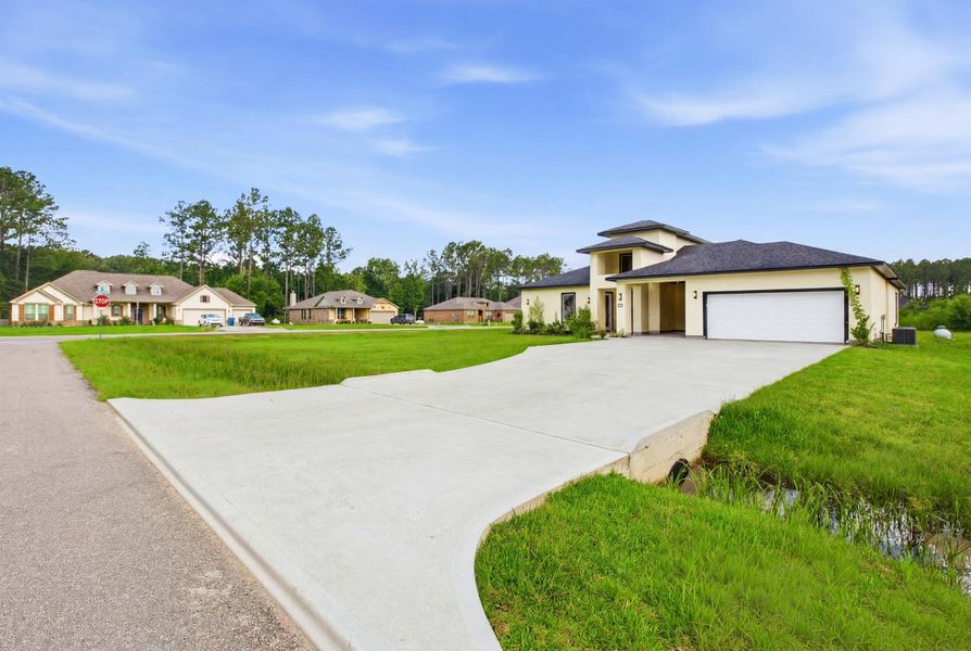 Front exterior of a new home in , Dayton, TX, highlighting curb appeal (Image 2). Front exterior of a new home in , Dayton, TX, highlighting curb appeal (Image 2).