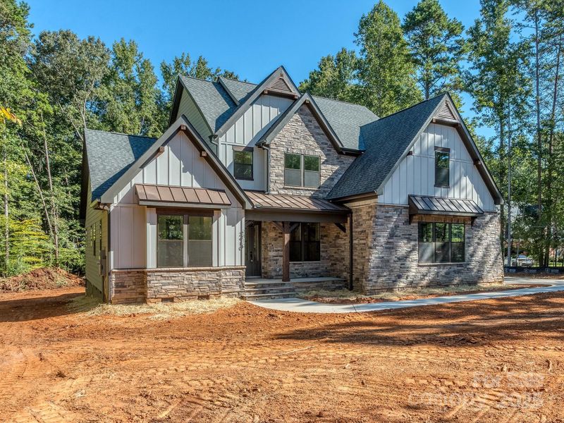 Front exterior of a new home in , Matthews, NC, highlighting curb appeal (Image 26).