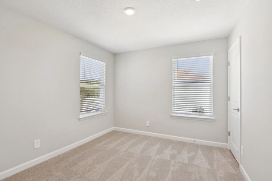 Bedroom 2 features two windows