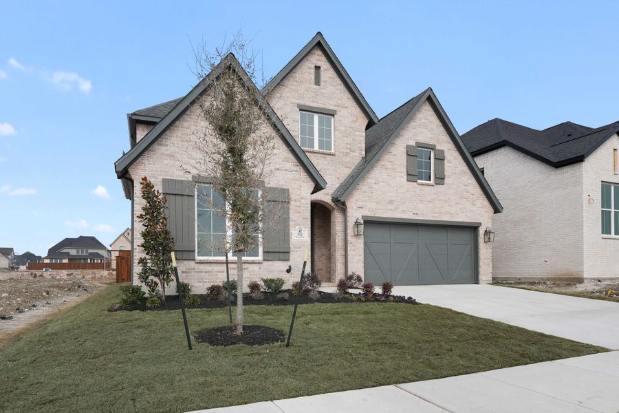 Front exterior of a new home in Hillside Village, Celina, TX, highlighting curb appeal (Image 23). Front exterior of a new home in Hillside Village, Celina, TX, highlighting curb appeal (Image 23).