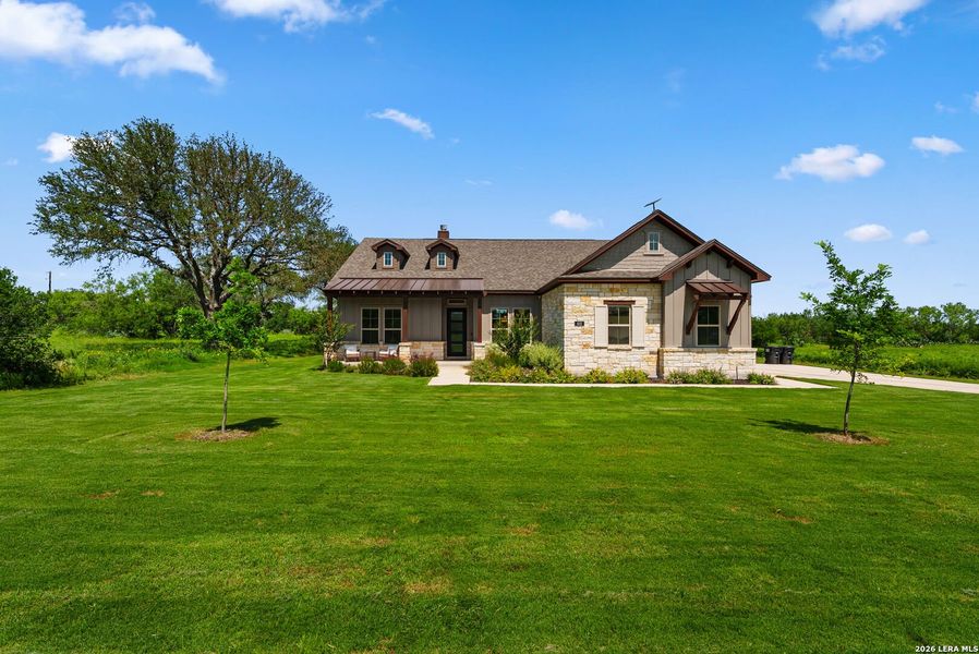 Front exterior of a new home in Legend Park, Castroville, TX, highlighting curb appeal (Image 22).