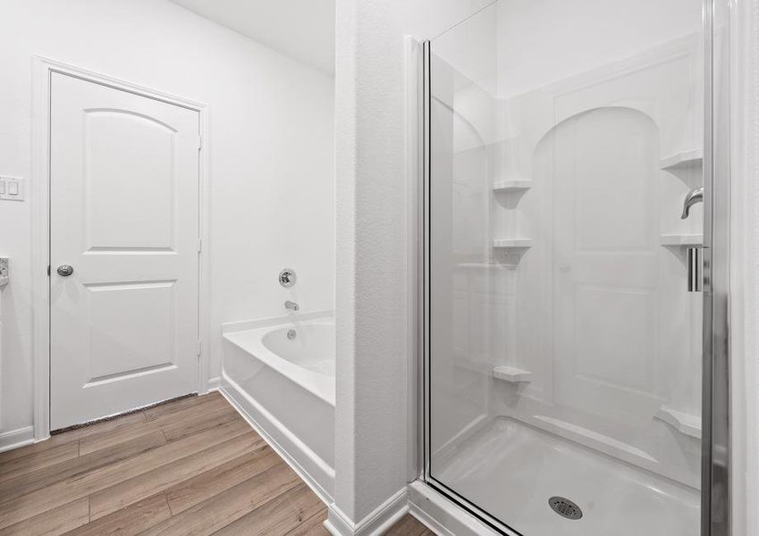 A walk-in shower and soaking tub can also be found in the master bath.