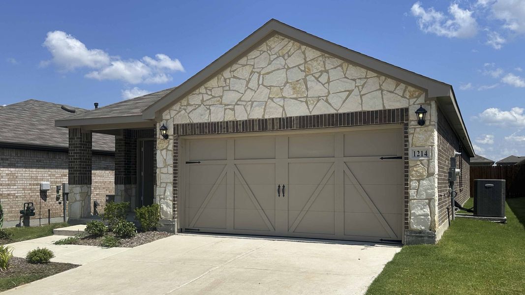 Front exterior of a new home in Cartwright Ranch, Crandall, TX, highlighting curb appeal (Image 2).