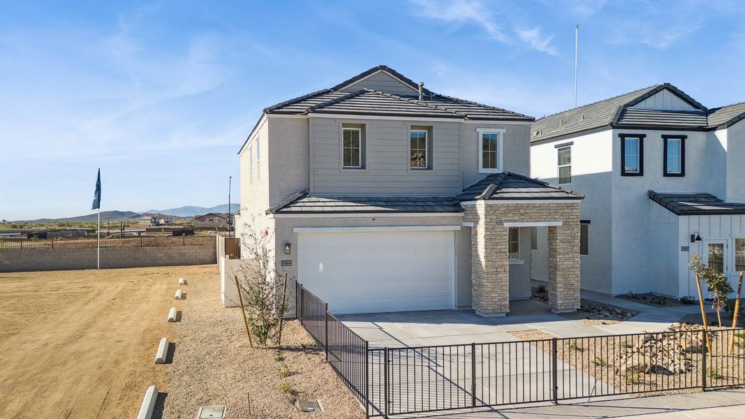 Representative exterior photo of a completed home built from the Mirage by D.R. Horton in The Buttes at Mystic, Peoria, AZ (Image 29).