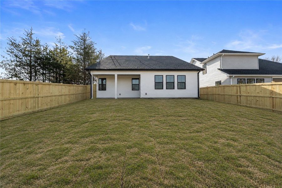A spacious backyard awaits, fully fenced for priva A spacious backyard awaits, fully fenced for priva